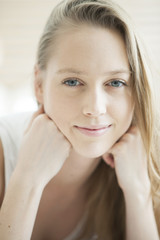 Fototapeta premium portrait of a beautiful young woman in her bedroom