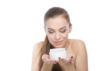 Woman with a moisturizer or body treatment