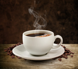 Coffee cup and wooden table dark background (clipping path).