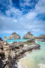 Fototapeta na wymiar huge rock near the beach in Fernando de Noronha Stock Photo: