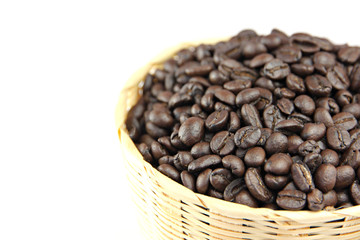 Roasted coffee beans in basket.