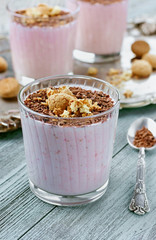 Milkshake with chocolate and cookies on a blue wooden board