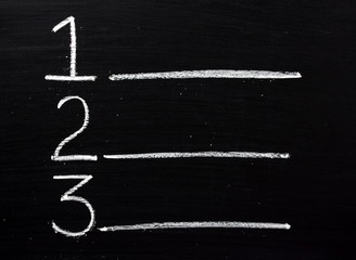 One,Two or Three list written on a blackboard