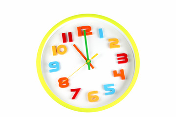 Colorful clock in telling time of eleven o'clock.