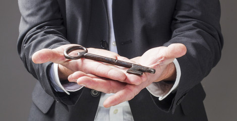 Fototapeta premium displaying an old key for unlocking a career
