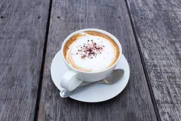 Hot Coffee cup on Wooden Table