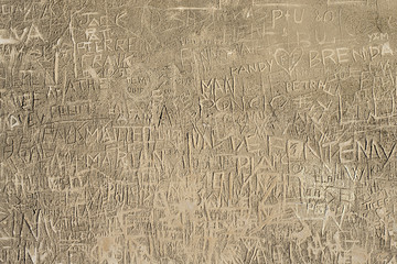 Old background wall scratched with names
