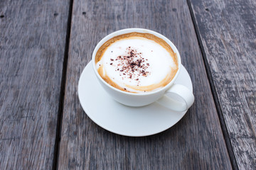 Hot Coffee cup on Wooden Table