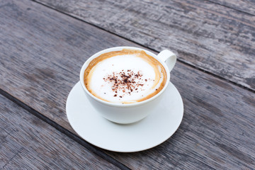 Hot Coffee cup on Wooden Table