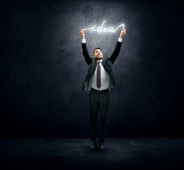 Businessman holding luminous idea