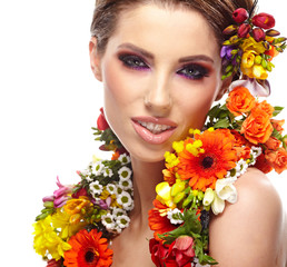 Fototapeta premium portrait of a woman dressed in spring flowers