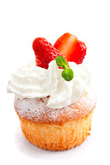 cupcake with cream and strawberries, isolated