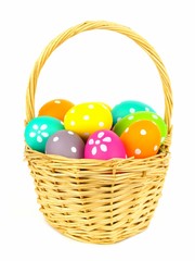 Easter basket filled with colorful eggs isolated on white