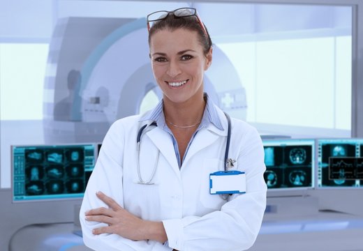 Mid-adult female doctor in MRI room at hospital