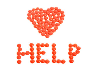 Red heart drugs. Pills arranged in heart shape with help sign.