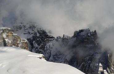 Clouds over a mountain peak