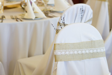 Fototapeta na wymiar decoration on wedding chairs cover