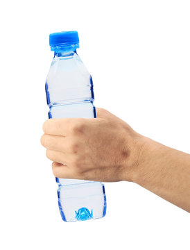 Human hand holding a bottle of water isolated on white