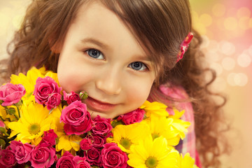 Smiling girl with a bouquet of flowers