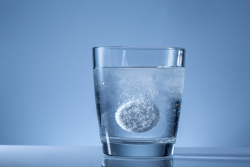 effervescent tablet in a glass of water