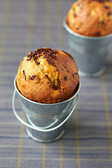 Banana muffins with chocolate in metal pails
