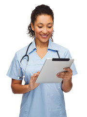 doctor or nurse with stethoscope and tablet pc