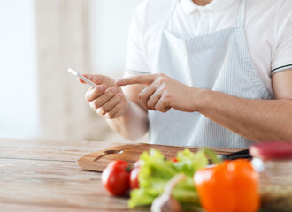 closeup of man pointing finger to smartphone