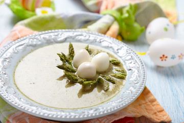 Spring green broccoli soup with asparagus nest
