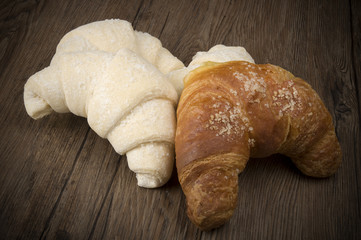 Frozen and fresh Croissants ready to oven on the wood.