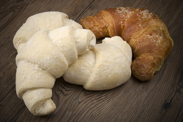 Frozen and fresh Croissants ready to oven on the wood.