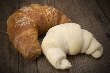 Frozen and fresh Croissants ready to oven on the wood.