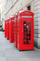 Red telephone pay phone London England UK