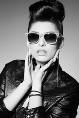 beautiful punk woman model wearing sun glasses and