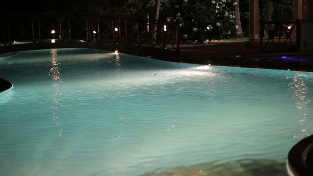 Luxury hotel swimming pool at night