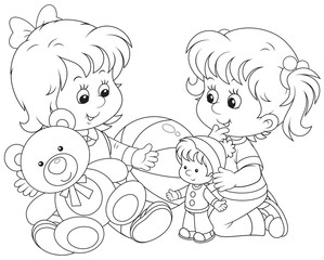 Little girls play with toys on the floor