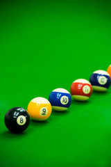 Pool game on green table