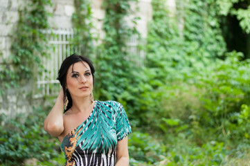 Fototapeta premium Young beautiful girl on a walk in the country