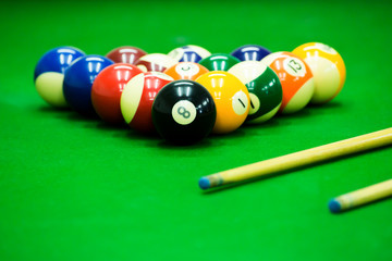 Pool game on green table