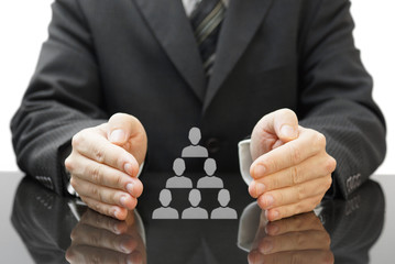 businessman's protecting  employees in his company. concept of e