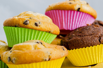 Muffins - homemade cupcakes in colorful molds