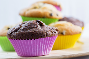 Muffins - homemade cupcakes in colorful molds