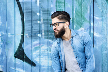 Male fashion model with beard and glasses