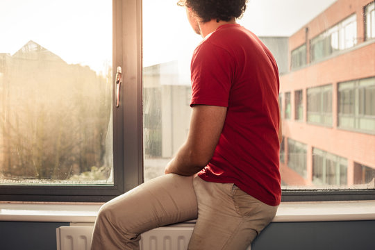 Young Man On Window Sill