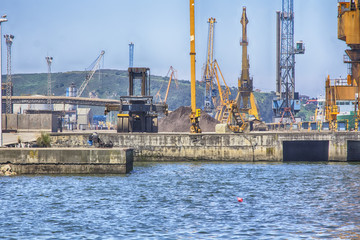 Fototapeta premium huge cranes of a charging port for ships