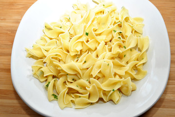 Egg Noodles with Butter on a White Plate