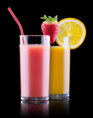 tasty summer fruits with juice in glass