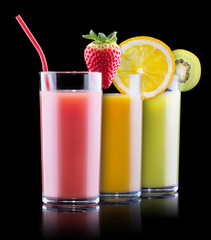 tasty summer fruits with juice in glass