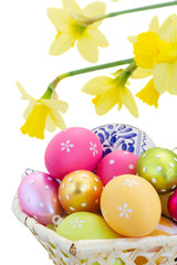 heap of easter eggs and daffodils