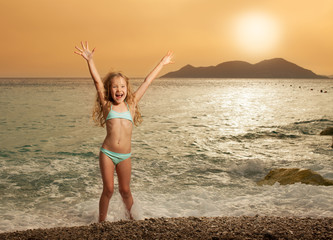 Girl on beach at sunset