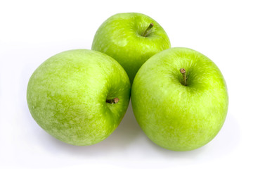 Three green apples on a white background